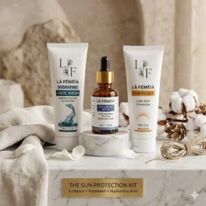 The Sun-Protection Kit by LaFemeia featuring Hydrating Face Wash, Hyaluronic Serum, and Zinc Sunblock arranged on a luxury marble vanity setup in Pakistan.